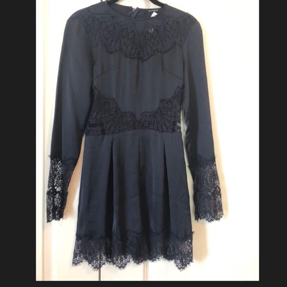 Never worn, navy romper with lace detail